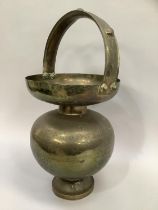 20th century Indian engraved kamandalu brass holy water carrier, 59cm high