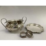 A George V silver sugar bowl, Birmingham, 1914 for Joseph Gloster, oval panelled with C-scroll