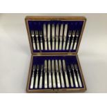 A cased set of silver plated dessert knives and forks by A & D Sheffield England, with mother of