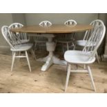 A painted and oak topped dining table with baluster supports and pull out folding leaf together with