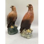 Two golden eagle decanters, one for Whyte and Mackay Scotch whiskey, modelled by John G Tongue,