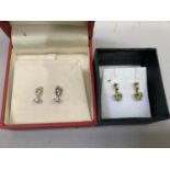 A pair of diamond stud earrings in 9ct. gold, each illusion set with a small brilliant cut stone