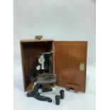 Black microscope in oak case