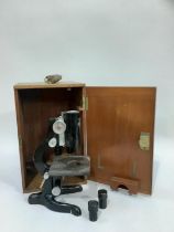 Black microscope in oak case