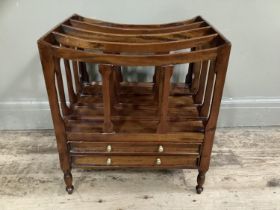 A reproduction fruitwood Canterbury with four compartments, two drawers to the front, on turned