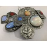Eight pieces of Art pewter jewellery set with cornelian, paste and studio pottery cabochons
