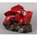 A Royal Doulton Flambe Figure of a Dragon, modelled on a rock, marked to the front left paw with