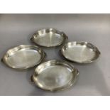 Four silver plated twin handled dishes