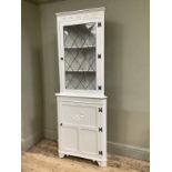 Painted Ercol corner cupboard with top pedestal with one single glazed door with leaded window