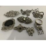 A collection of mid to late 20th. century marcasite set silver jewellery including a dress clip, two