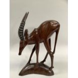Wooden carved figure of a gazelle