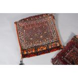 Two Middle Eastern Camel Bags of fox red and diamond pattern and wine with panel medallion
