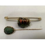 A 19th. century tropical beetle brooch, the polly chrome carapace set in leg-like claws to the