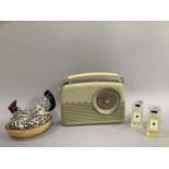 Vintage white bakelite Bush radio, Emma Bridgewater hen on nest two Jo Malone bottles of bath oil