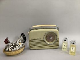 Vintage white bakelite Bush radio, Emma Bridgewater hen on nest two Jo Malone bottles of bath oil