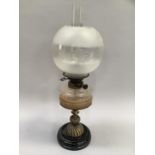 A 19th century oil lamp by T. Rowatt and sons, having an etched and opaque shade, smoked glass