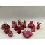 Quantity of 19th century and later cranberry glass including sugar sifters with silver plated