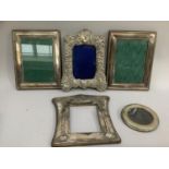 Three silver fronted photograph frames (two A/F) together with a pair of silver plated photograph