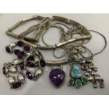 A purple foil backed paste necklace, each oval facetted stone collet set in a closed back setting,