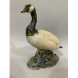 Cast sculpture of a Canada Goose on a naturalistic base, 29cm high