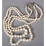 A cultured pearl two row necklace, the graduated pearls fastened with a silver and colourless foil