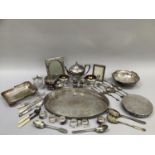 Quantity of silver plate comprising two photograph frames, cut glass preserve jar, table mats,