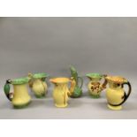 Three Burleigh ware jugs with moulded squirrel handles, one with a parrot handle and another bearing