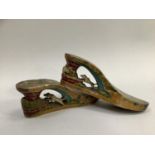 Early 20th century Philippino souvenir wooden sandal, the heel carved with a dog chasing a cat