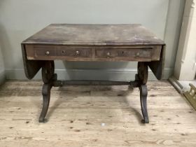 A regency mahogany sofa table with two small drawers and stretcher