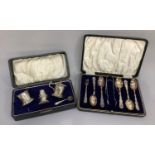 A George V silver boxed condiment set A/F together with five boxed George V silver teaspoons and