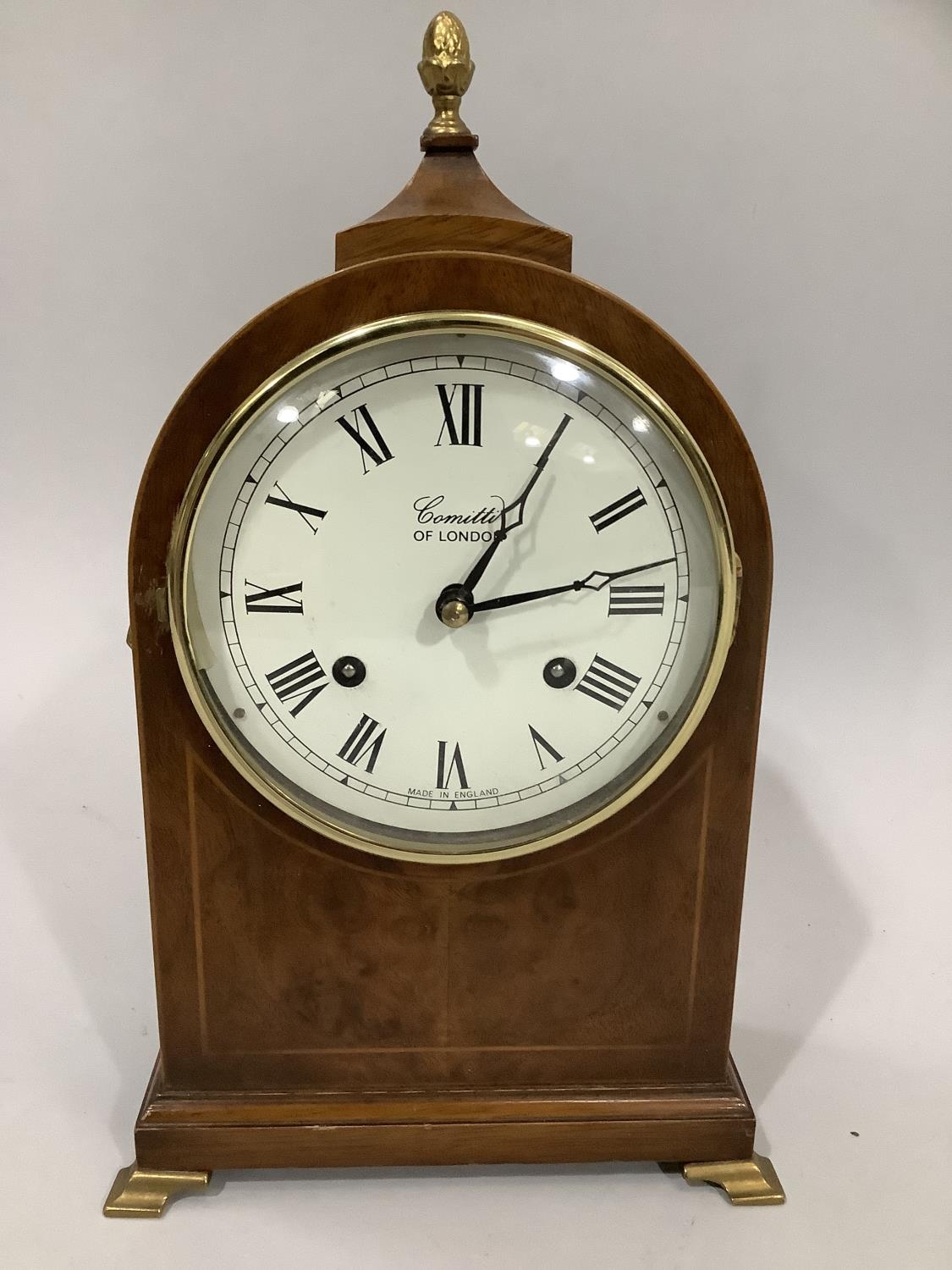 A 20th century walnut mantle clock by Comitti of London, the enamel dial with Roman numerals, in - Image 2 of 3