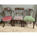 Three mahogany chairs, one with ornate carved legs and balloon back carved with fruiting vine,