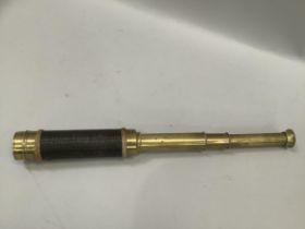 A three draw brass telescope by J.H Steward, 406-66 Strand, London