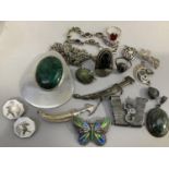 A collection of white metal jewellery (tests as silver) variously set with enamel, niello, hematite,