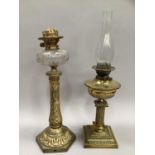 A Victorian oil lamp by Messengers having brass fluted reservior above brass column support on