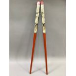 A large pair of Chinese chopsticks, painted in orange and cream with bamboo