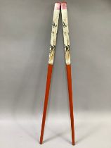 A large pair of Chinese chopsticks, painted in orange and cream with bamboo