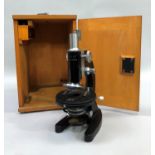 A mid 20th century microscope, L-201, Chinese black enamel and steel, with original wooden case