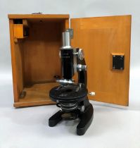 A mid 20th century microscope, L-201, Chinese black enamel and steel, with original wooden case