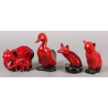 Four Royal Doulton flambe figures of an elephant mother and child group, duck fox and cat, marked to