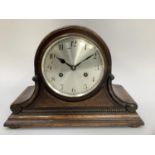 Early 20th century oak cased mantel clock, silvered dial with Arabic numerals and German movement,