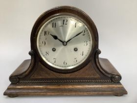 Early 20th century oak cased mantel clock, silvered dial with Arabic numerals and German movement,