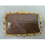 A Victorian plaque brooch, the jasper, agate, panel collet set with a gold plated pierced scroll,