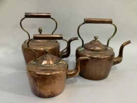 Three 19th century copper kettles of varying sizes