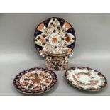 Royal Crown Derby plate pattern number 6041, two further plates and a twin handled sugar bowl with