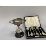 Five boxed silver George V Jubilee tea spoons, Sheffield 1935 for R Bond & Co plus one other