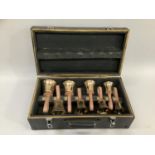 Set of eight musical handbells in fitted case with leather straps