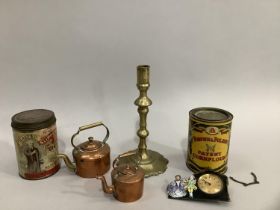 Two miniature copper kettles, two vintage advertising tins, an enamel German clock and brass