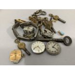 A collection of pocket watch keys together with an early 20th. Century silver ladies watch bracelet,