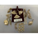 A collection of stud and pendant earrings including a pendant and locket both hung on fine trace